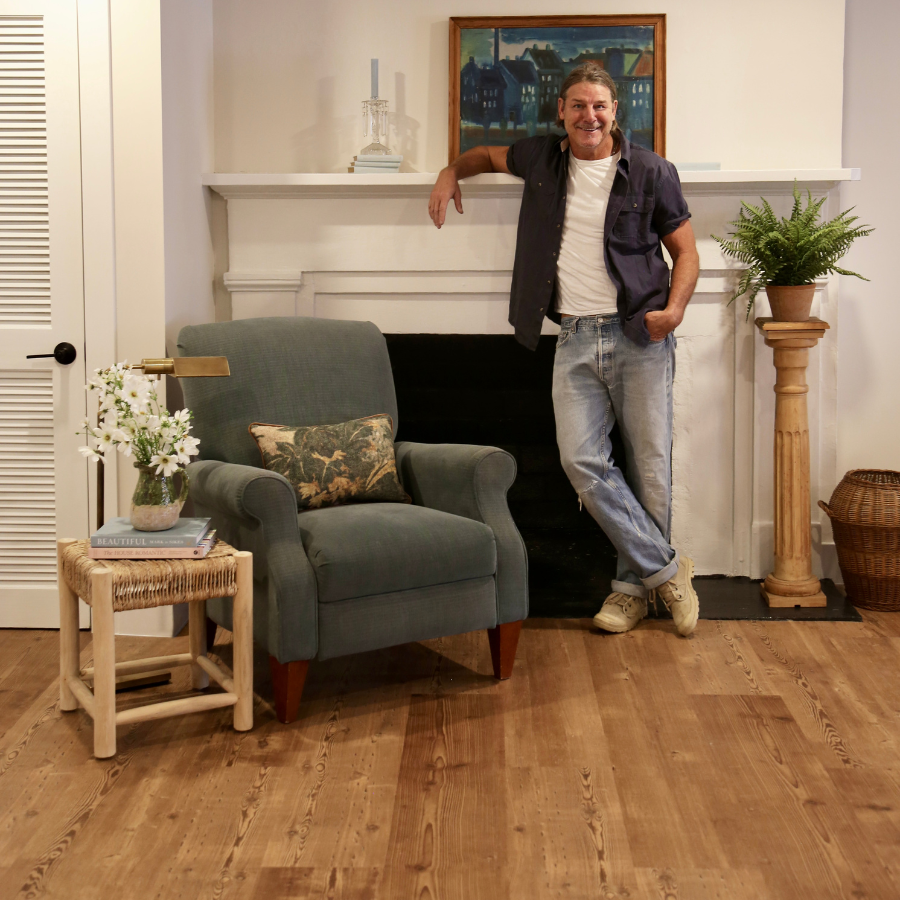 Ty in the parlor with Reclaimed Heart Pine floors