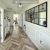 Karndean lime washed oak wood flooring laid in herringbone in a hallway