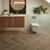 Duxbury Acacia herringbone wood LVT flooring in a bathroom