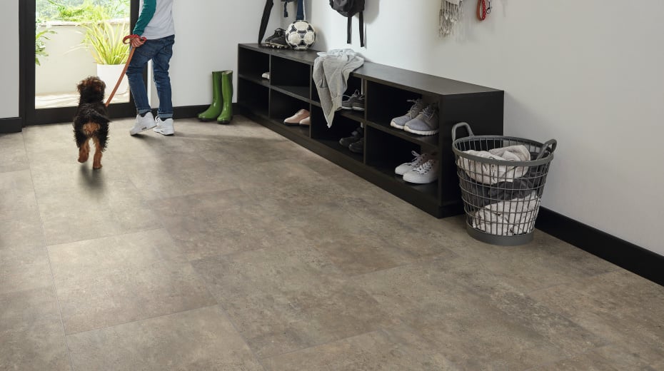 Kid and dog exiting mudroom with Sandstorm RKT3010-G floors